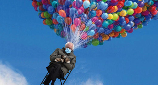 photo of Bernie Sanders wearing mittens seated in a chair being lifted up into blue sky by huge bunch of multicolored balloons